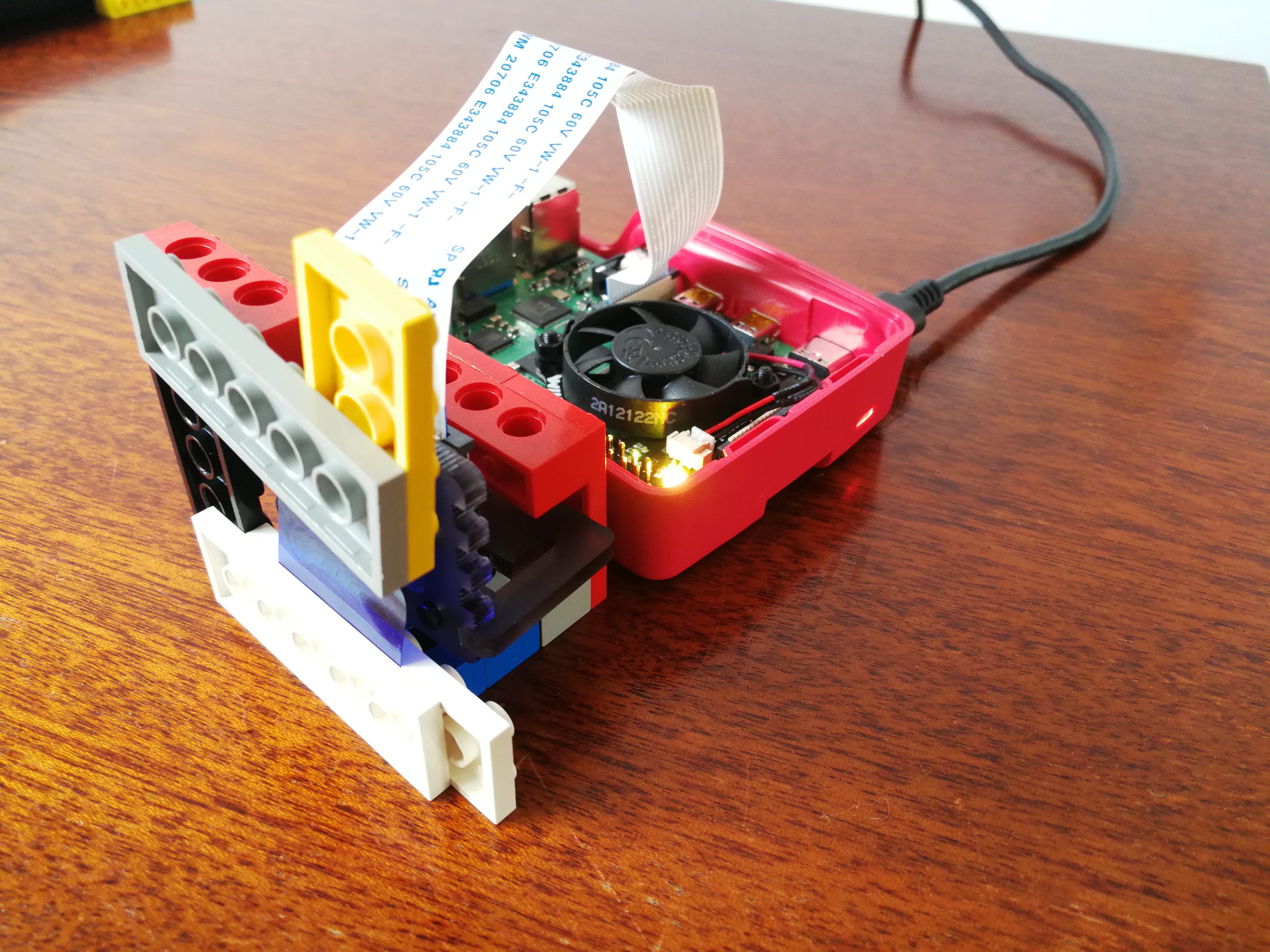 Raspberry Pi 4 with camera in makeshift lego stand.