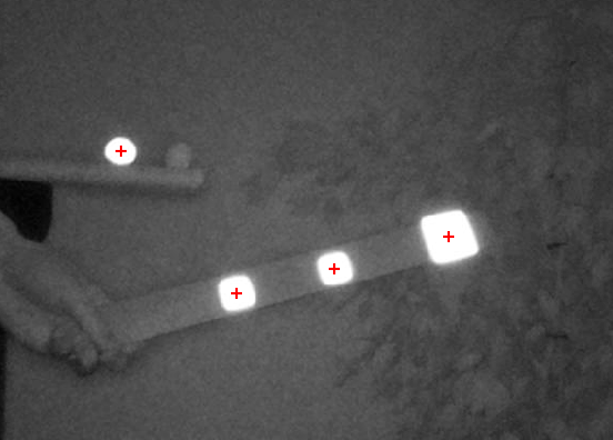 Pi camera infrared image with bright spots with a red cross in the middle for each of the markers.